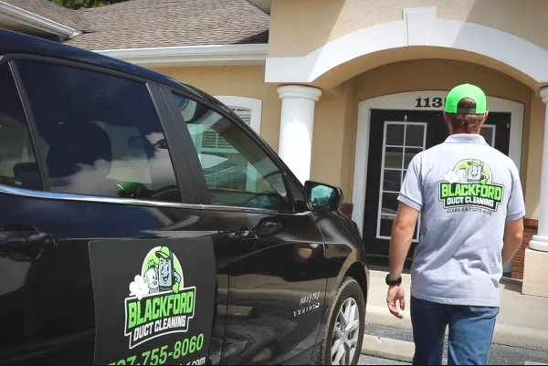 Zane entering a residence to provide a safe and effective duct cleaning service.